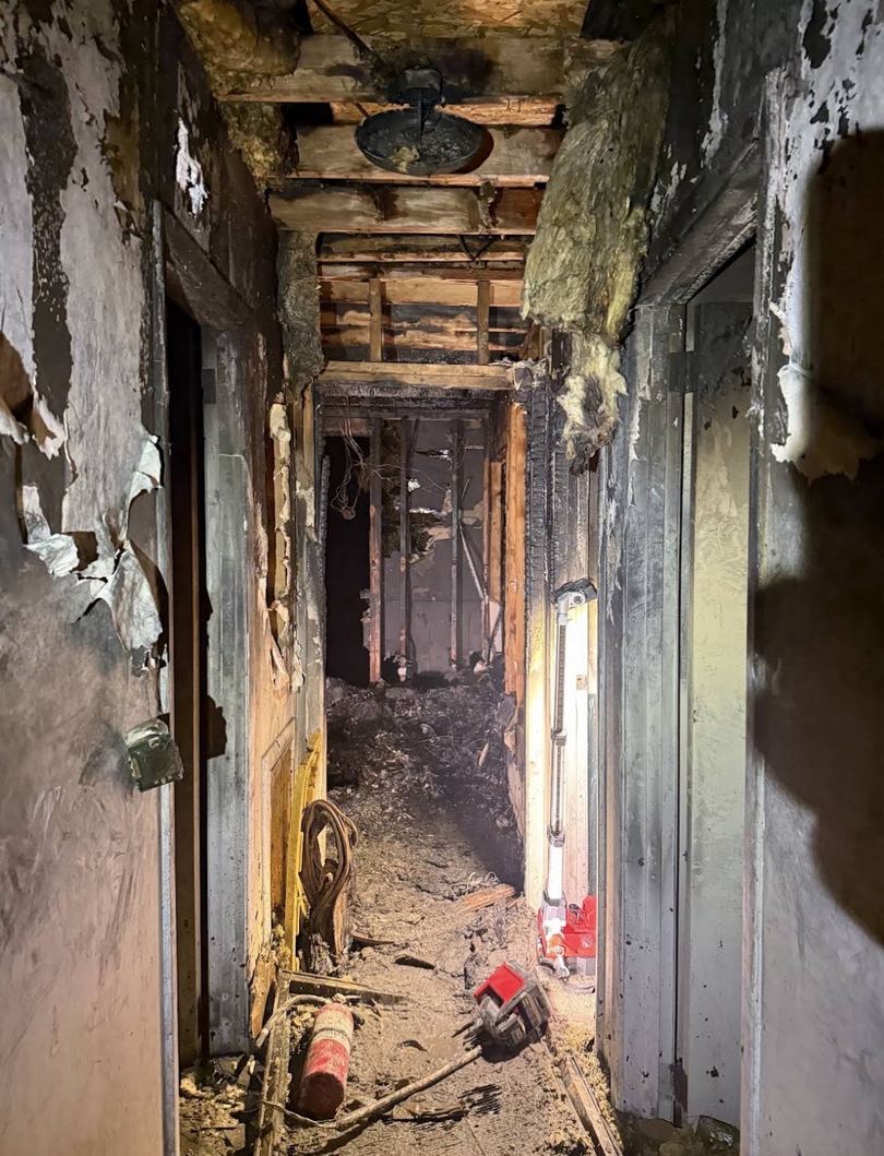 Charred hallway after an apartment fire.