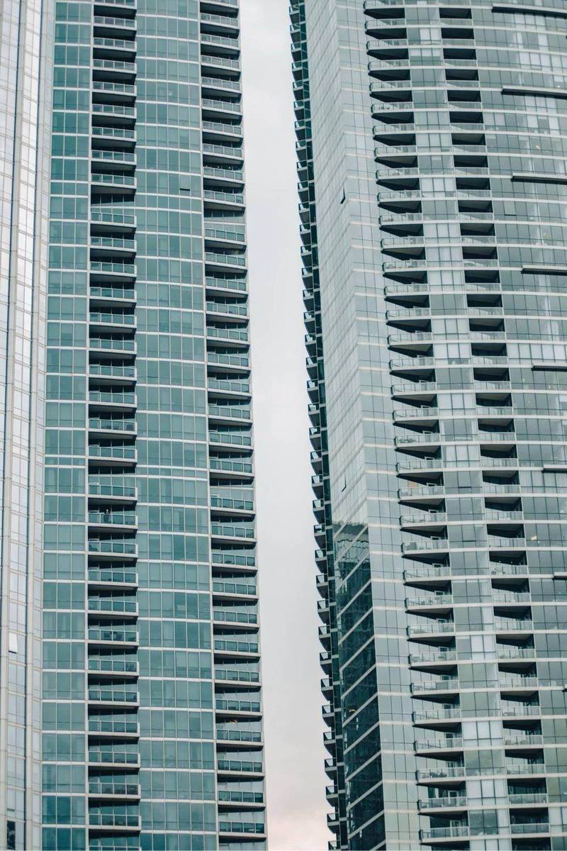 Residential high-rise towers in Manhattan seen from the street.